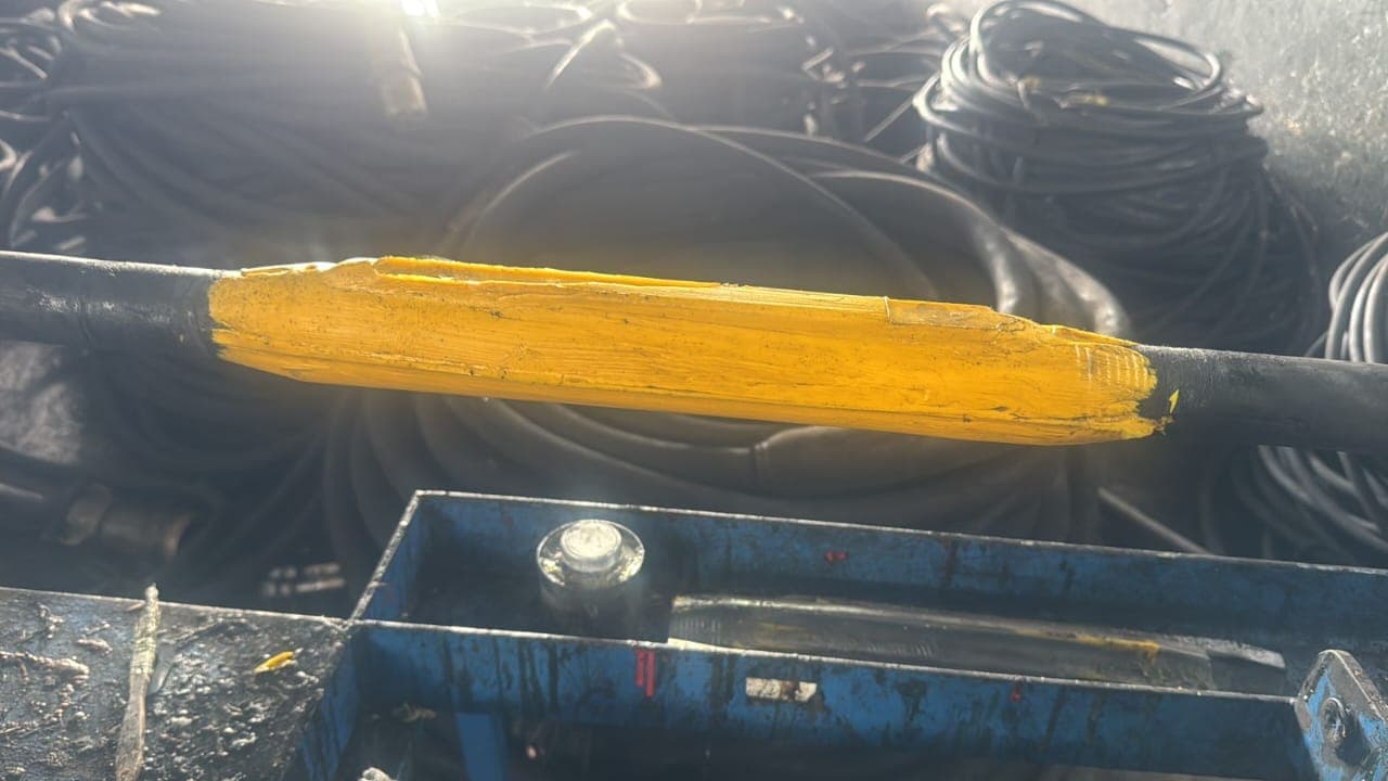 A single Bosworth Flexable resin joint moulded over a repaired mining cable, cable coils behind